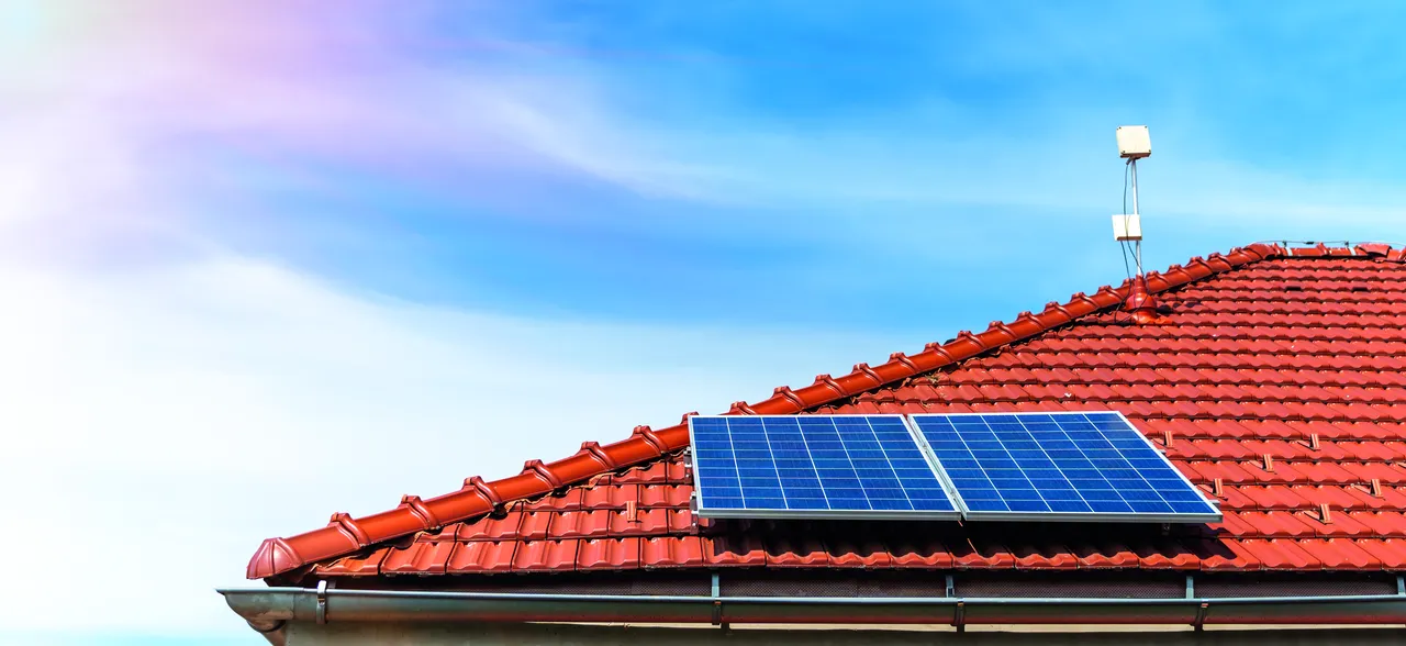 Residential rooftop solar installation on tiled roof